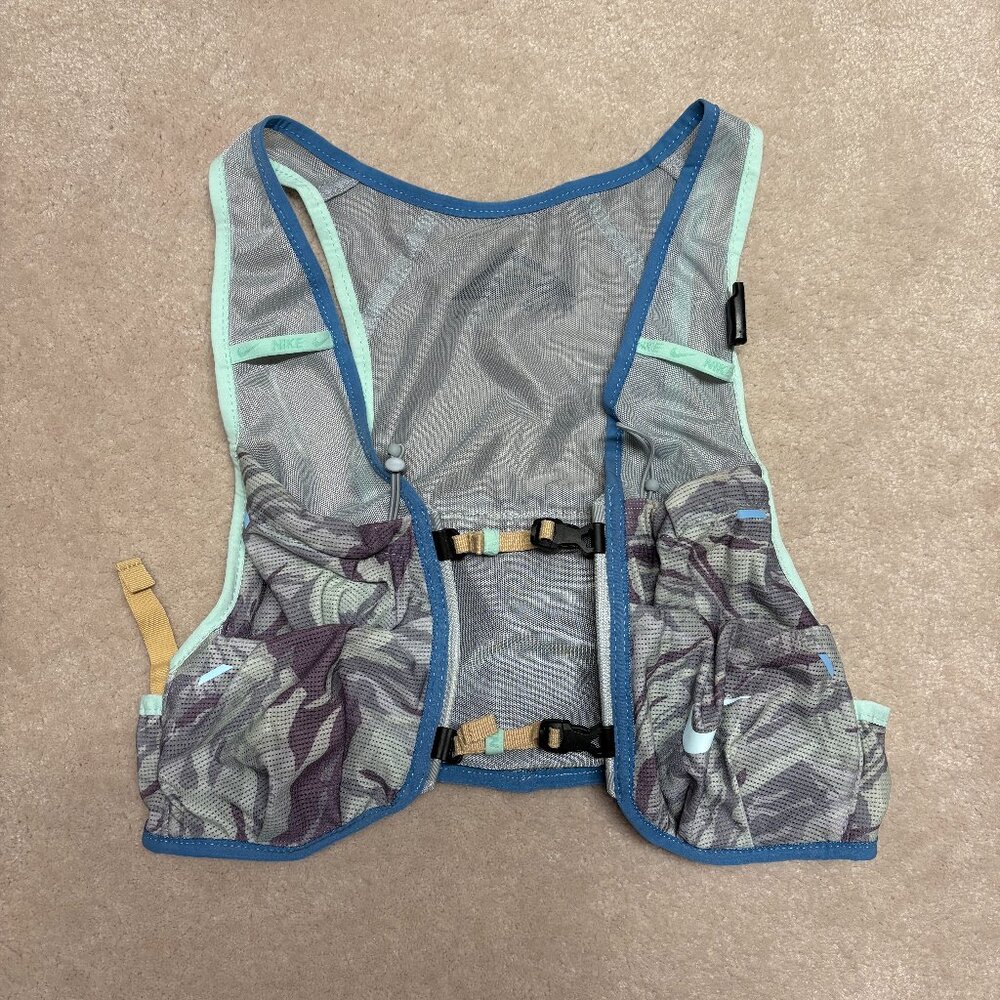 Nike Trail Vest 2.0 in the Wolf Grey, Canyon Purple, Mint Foam, and Dutch Blue